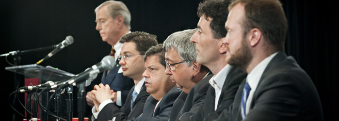 From left to right: Don Newman, former CBC political journalist and host of the debate; Members of Parliament Pierre Poilièvre (Conservative Party); Mauril Bélanger (Liberal Party); Richard Nadeau (Bloc Québécois); Paul Dewar (NDP); and Jean-Luc Cooke (Gr