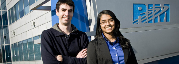 From left to right, developer Chris Coughtrey and his coop student Allyshia Sewdat during her internship at RIM, in front of the corporation’s building on Solandt Road in Ottawa.